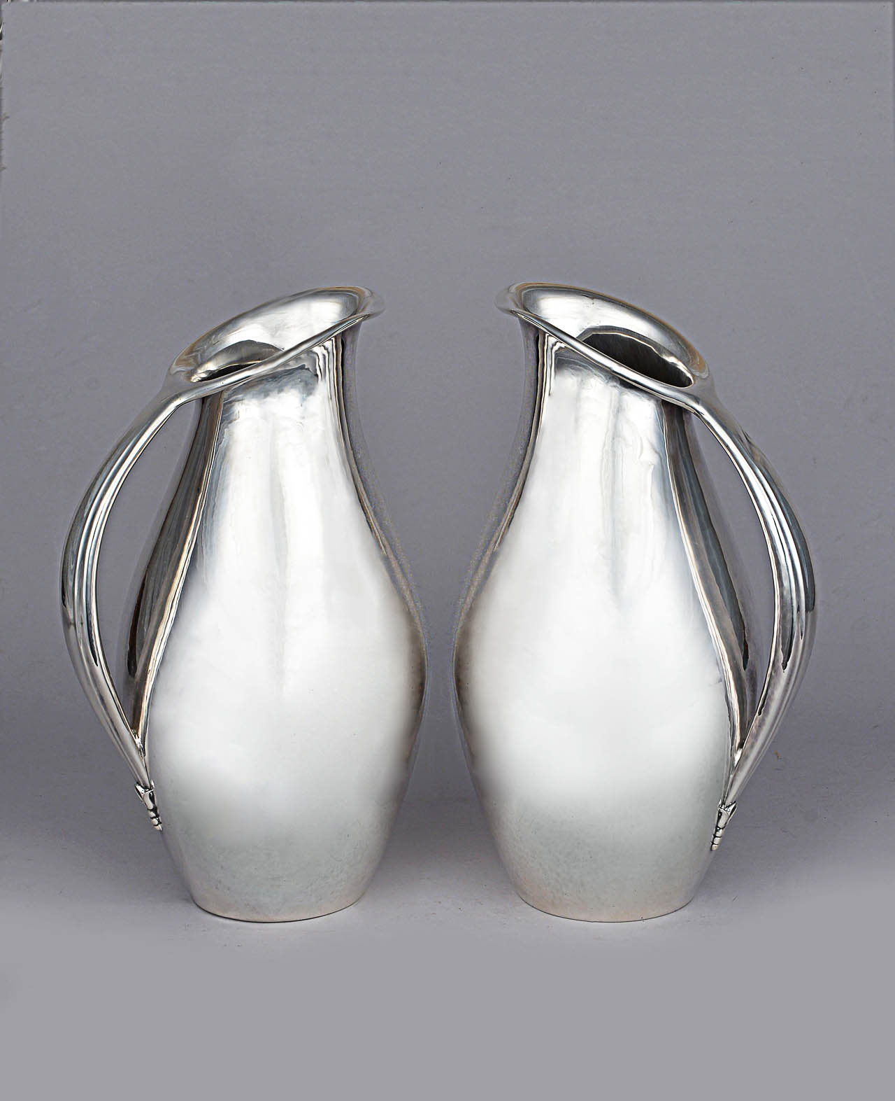  PAR DE 'MATCHING DANISH SILVER PITCHERS'.