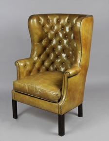 Lote 183: SILLON DE CUERO INGLES CON BANQUETA APOYA PIES. SILLON DE CUERO INGLES CON BANQUETA APOYA PIES.